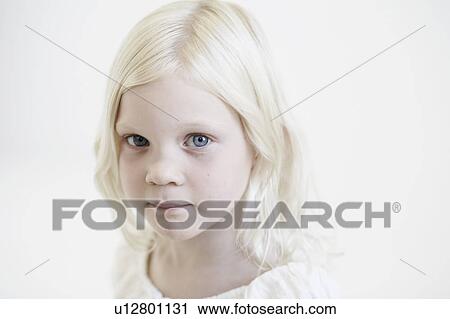 Stock Image - Portrait of young girl looking to camera. Fotosearch