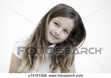 Stock Photo - Portrait of young girl smiling to camera. Fotosearch