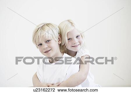 Portrait young girl hugging young boy View Large Photo Image Stock Image - Portrait young girl hugging young boy. Fotosearch