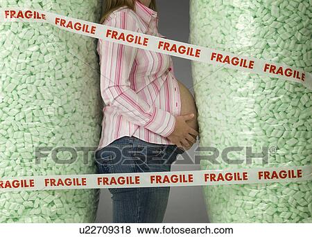 Stock Photo - pregnant woman in protective packaging. Fotosearch