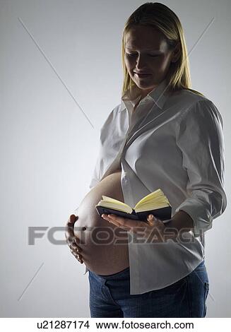 pregnant woman reading diary View Large Photo Image Picture - pregnant woman reading diary. Fotosearch