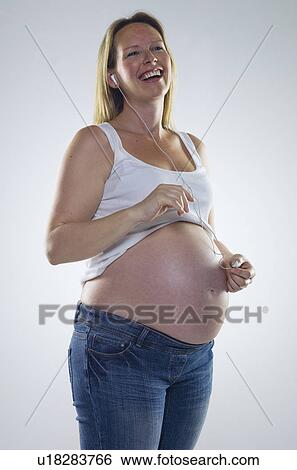 pregnant woman with headphones View Large Photo Image Stock Photograph - pregnant woman with headphones. Fotosearch