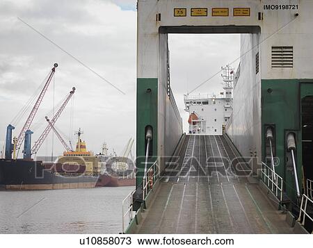 Stock Image - Ramp On To Ship At Port. Fotosearch