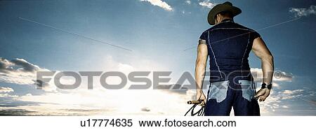 Stock Photography - Rear of cowboy. Fotosearch