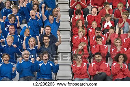 Stock Image - Rival fans at football match. Fotosearch