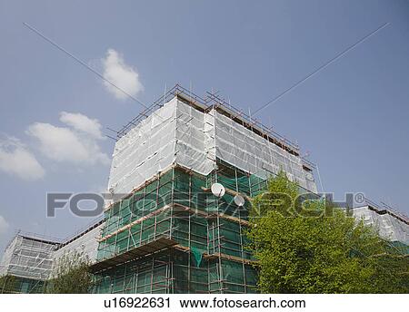 Stock Image - Scaffolding with satellite dishes. Fotosearch
