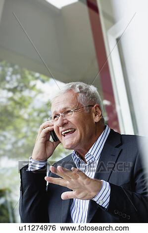Stock Photograph - Senior Businessman Using Cellphone. Fotosearch