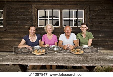 Stock Photo - senior couple and two daughters. Fotosearch