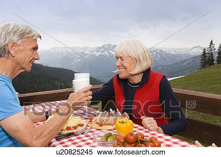senior couple eating in mountains View Large Photo Image Stock Photography - senior couple eating in mountains. Fotosearch