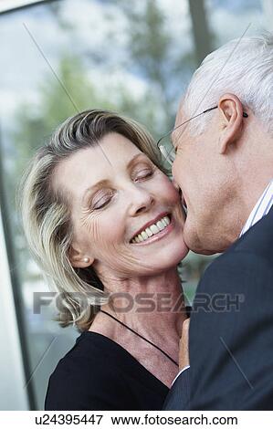 Stock Photo - Senior Couple Kissing. Fotosearch