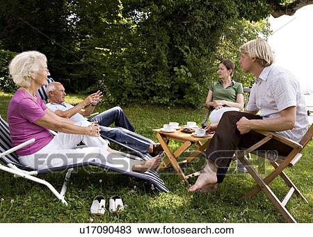Stock Image - senior couple, man, woman sit together. Fotosearch