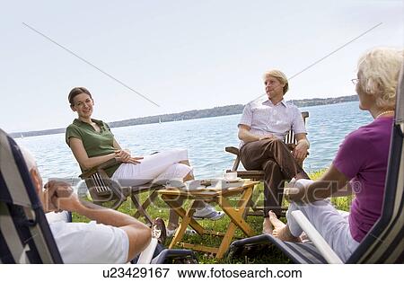 Stock Photo - senior couple, man, woman sit together. Fotosearch