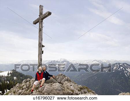 Stock Photo - senior couple on mountain summit. Fotosearch