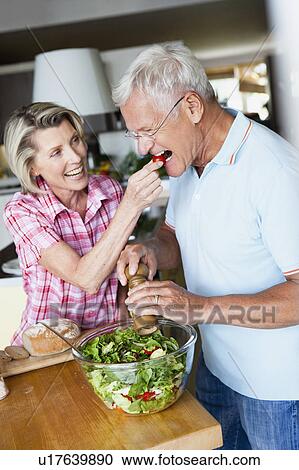 Senior Couple Preparing Salad View Large Photo Image Stock Image - Senior Couple Preparing Salad. Fotosearch
