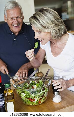 Senior Couple Preparing Salad View Large Photo Image Stock Photo - Senior Couple Preparing Salad. Fotosearch