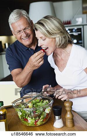 Senior Couple Preparing Salad View Large Photo Image Stock Photograph - Senior Couple Preparing Salad. Fotosearch