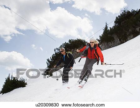 senior couple skiing in mountains View Large Photo Image Stock Image - senior couple skiing in mountains. Fotosearch
