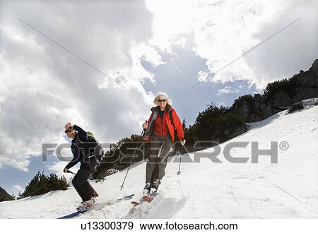 senior couple skiing in mountains View Large Photo Image Stock Photo - senior couple skiing in mountains. Fotosearch