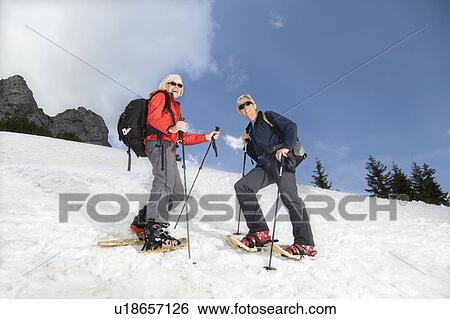 senior couple snowshoeing in mountains View Large Photo Image Stock Photograph - senior couple snowshoeing in mountains. Fotosearch