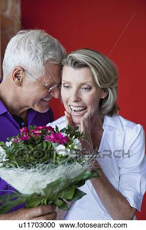 Stock Image - Senior Couple With Bouquet. Fotosearch