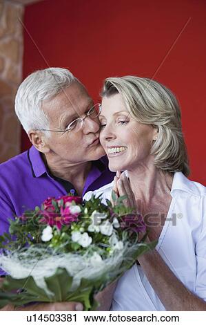 Stock Image - Senior Couple With Bouquet. Fotosearch