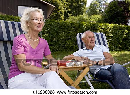senior man and woman in deck chairs View Large Photo Image Stock Photo - senior man and woman in deck chairs. Fotosearch