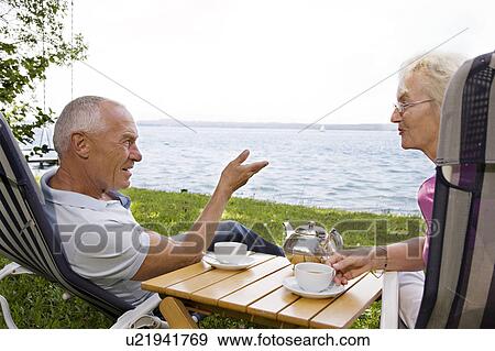 senior man and woman in deck chairs View Large Photo Image Stock Photo - senior man and woman in deck chairs. Fotosearch