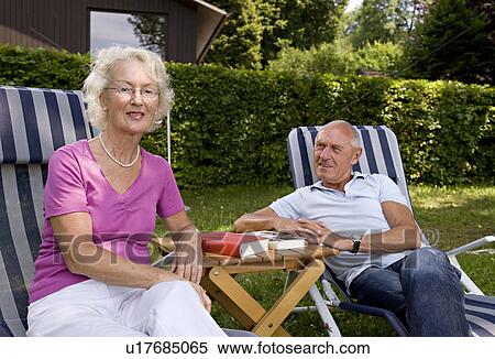 senior man and woman in deck chairs View Large Photo Image Stock Photography - senior man and woman in deck chairs. Fotosearch