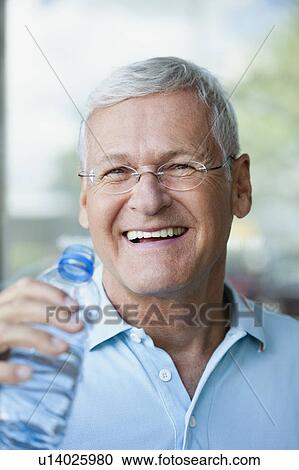 Stock Image - Senior Man Drinking Water. Fotosearch