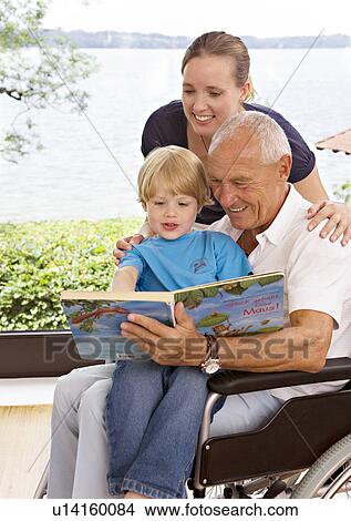 senior man reading book to boy View Large Photo Image Picture - senior man reading book to boy. Fotosearch