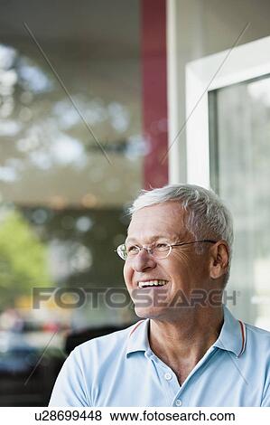 Stock Photo - Senior Man Watching. Fotosearch