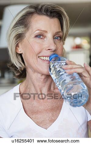 Stock Image - Senior Woman Drinking Water. Fotosearch