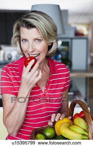 Senior Woman Eating Apple View Large Photo Image Stock Photo - Senior Woman Eating Apple. Fotosearch