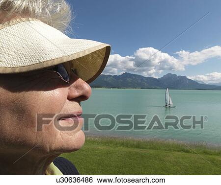 Senior woman gazing across lake View Large Photo Image Stock Photograph - Senior woman gazing across lake. Fotosearch