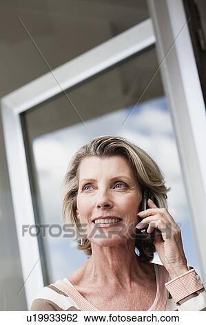 Senior Woman Using Cellphone View Large Photo Image Stock Image - Senior Woman Using Cellphone. Fotosearch