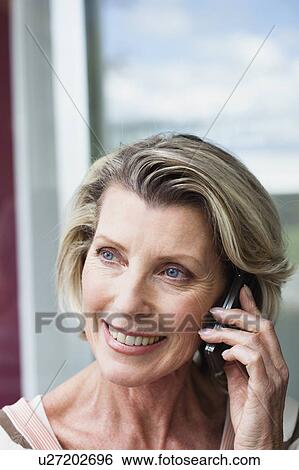 Stock Photograph - Senior Woman Using Cellphone. Fotosearch