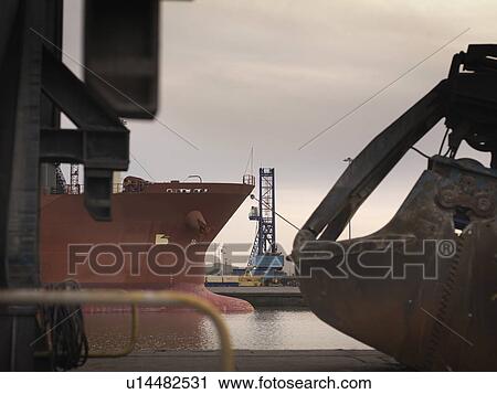 Stock Image - Ships & Heavy Machinery At Port. Fotosearch