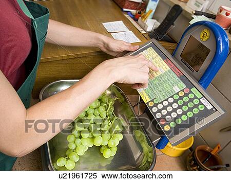 shopkeeper putting fruit on scale View Large Photo Image Stock Photography - shopkeeper putting fruit on scale. Fotosearch