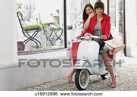 Stock Photograph - shoppingtour on a motor scooter. Fotosearch