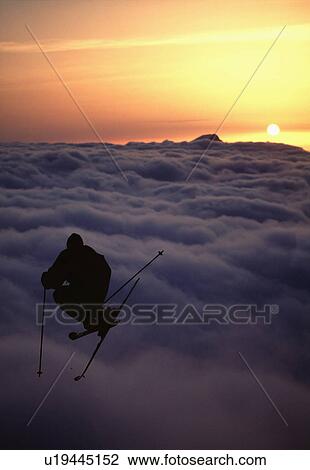 Stock Image - Silhouette of a skier jumping.. Fotosearch