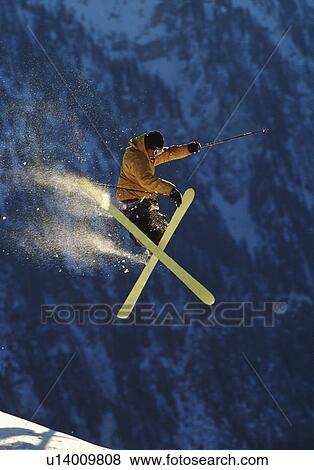 Skier jumping performing a trick View Large Photo Image Stock Photo - Skier jumping performing a trick. Fotosearch