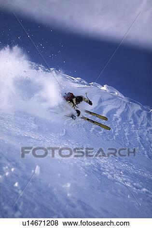 Stock Photo - Skier turning off piste. Fotosearch