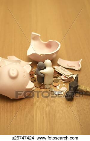 small figures and smashed piggy bank View Large Photo Image Picture - small figures and smashed piggy bank. Fotosearch