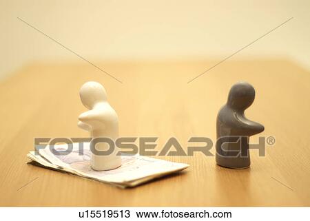 small figures, one on money View Large Photo Image Stock Image - small figures, one on money. Fotosearch