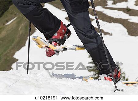 Stock Image - snow shoes on tour in mountains, detail. Fotosearch