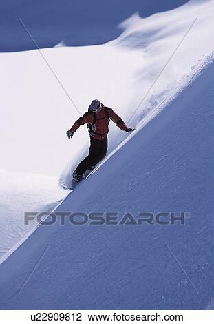 Snowboarder turning a slope View Large Photo Image Stock Image - Snowboarder turning a slope. Fotosearch