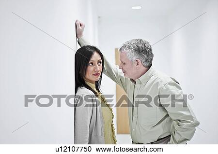 Stock Image - suggestive couple in corridor. Fotosearch