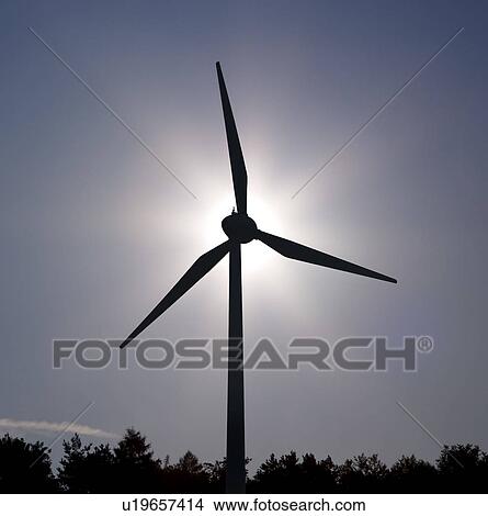 Picture - sun behind Wind Turbine. Fotosearch
