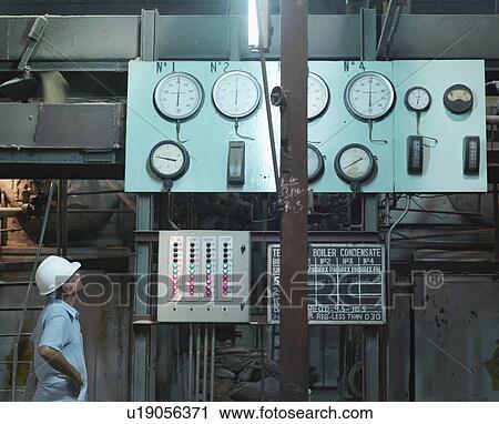 Stock Image - Supervisor In Sugar Cane Factory. Fotosearch