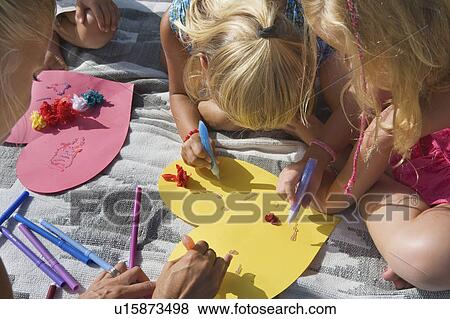 Teacher teaching students arts & crafts View Large Photo Image Stock Photo - Teacher teaching students arts & crafts. Fotosearch
